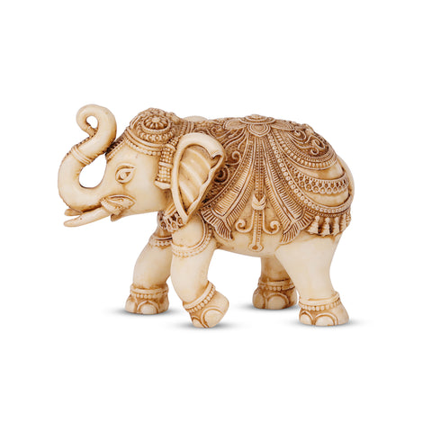 elephant statue with trunk up