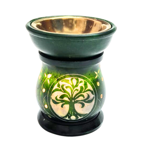 Decorative oil burner with green and gold design on a white background