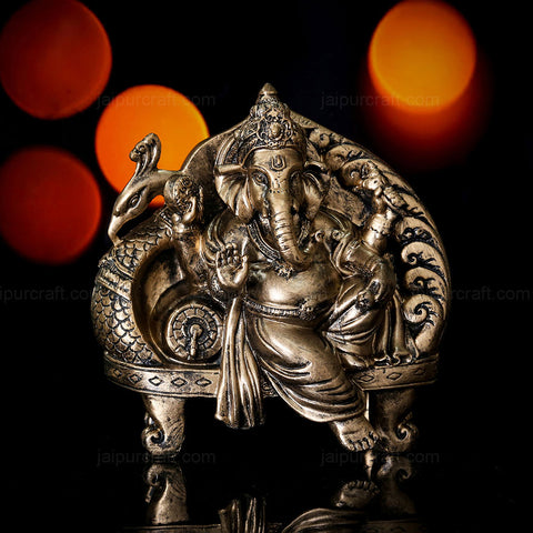 Lord Ganesh Idol Resting On Large Size Peacock Couch (Polyresin Moorti)